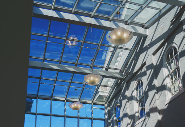 Harrisonburg City Hall Atrium Windows Looking up at the blue sky through atrium windows in Harrisonburg City Hall