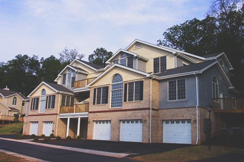 A garage and entrance side view of the Sunnyside Villas Retirement housing in Central, VA.